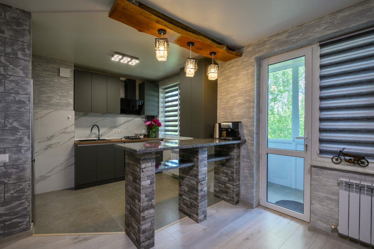 A showcase of a grey, modern kitchen with trendy window styles